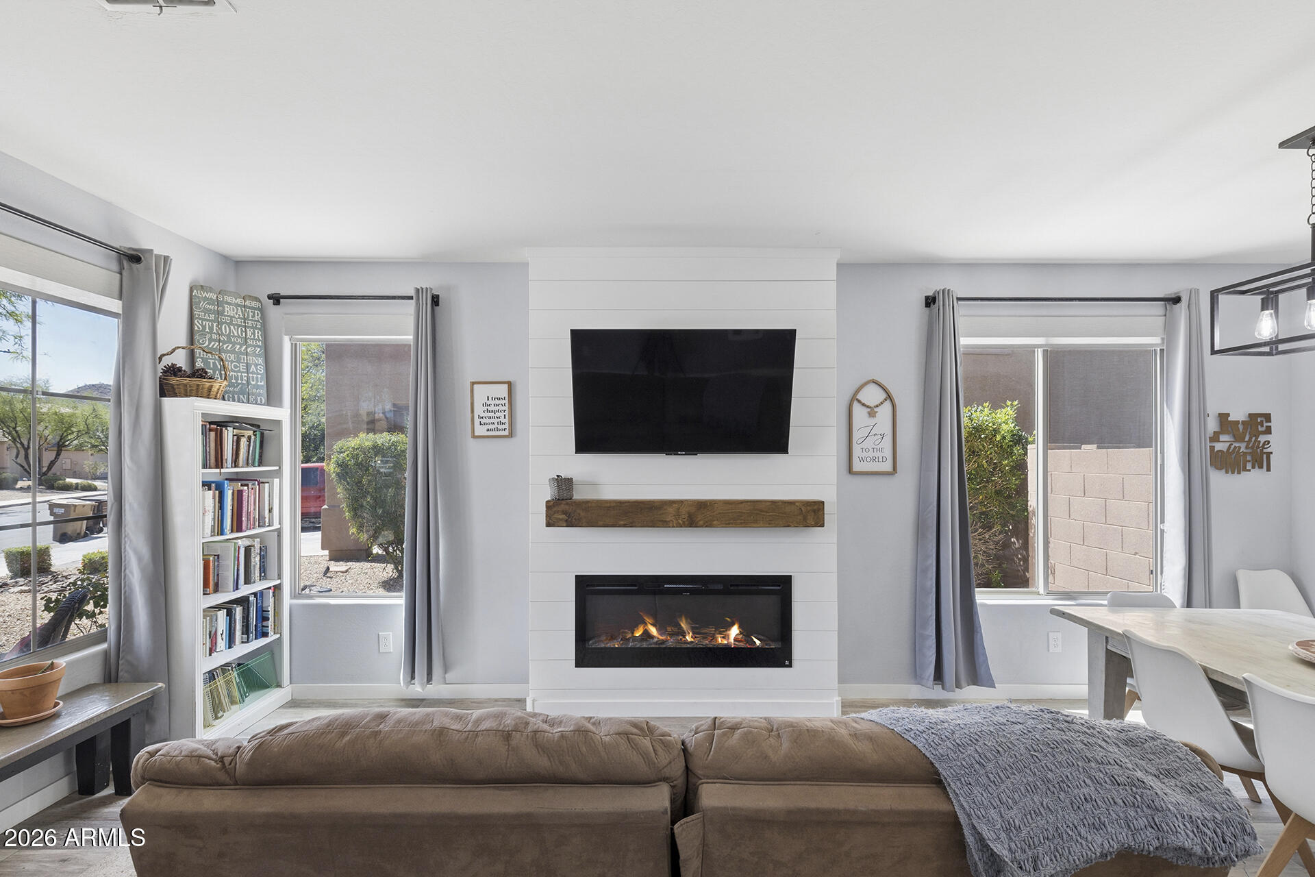 6848 West Ridgeline Road Peoria, AZ 85383 - Photo 7 of 71 a living room with furniture and a fireplace