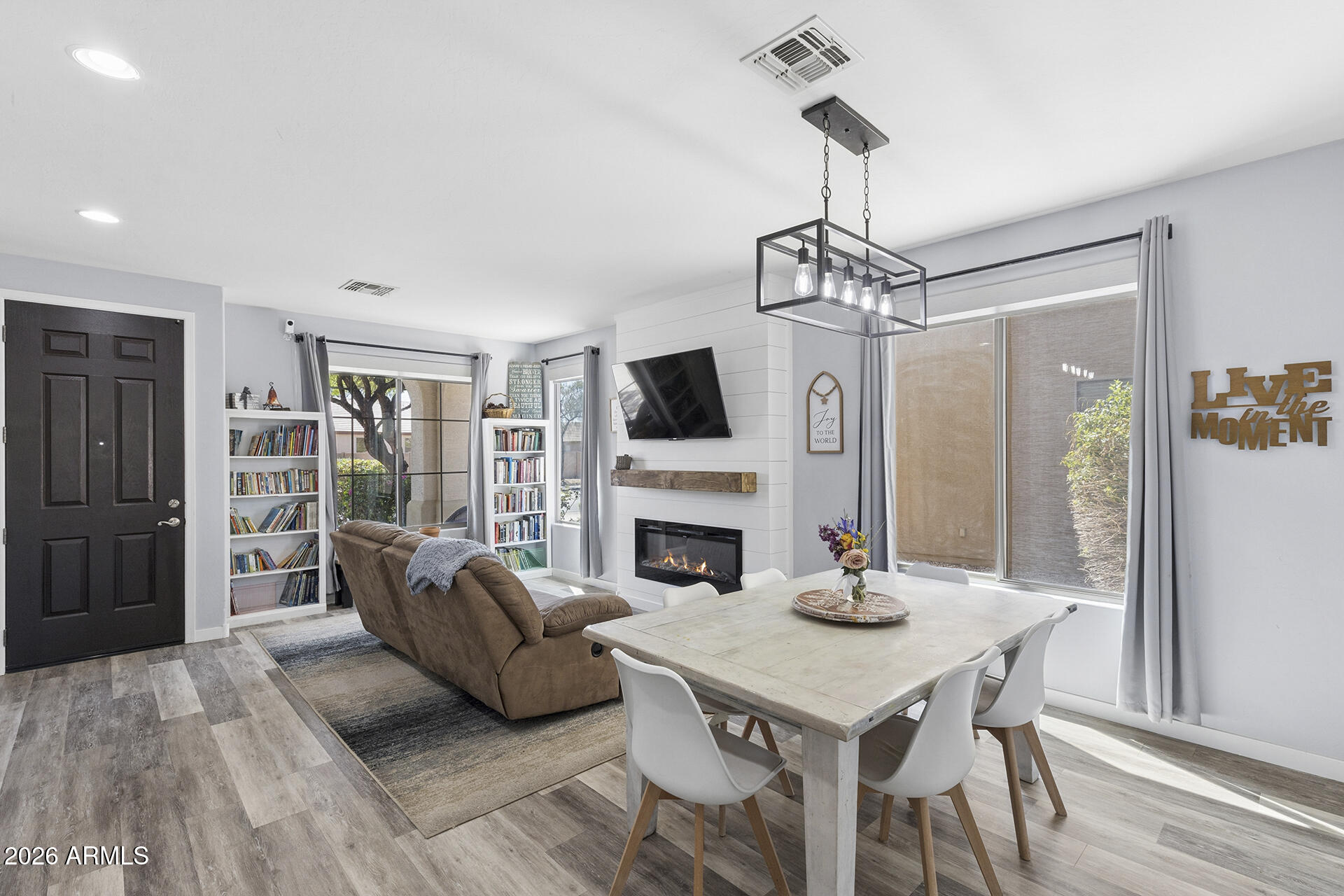 6848 West Ridgeline Road Peoria, AZ 85383 - Photo 9 of 71 a view of a livingroom with furniture window and wooden floor