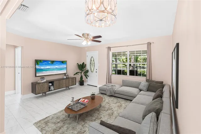a living room with furniture and a large window