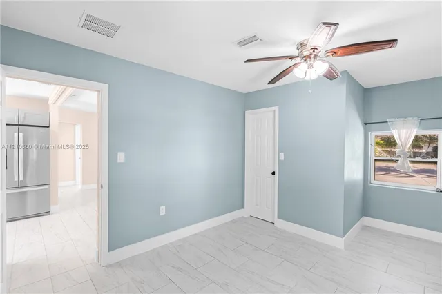 a view of an empty room and window