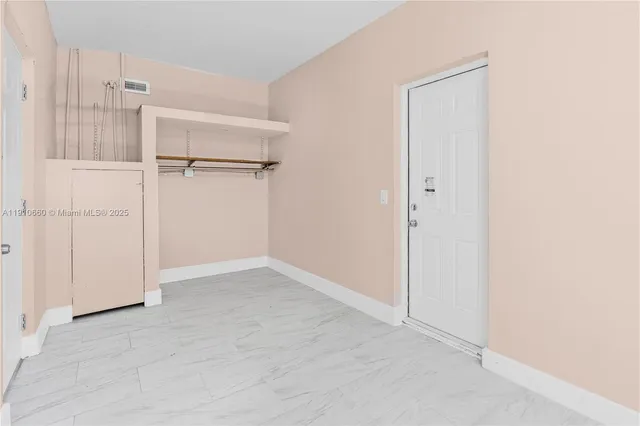 an empty room with shelves