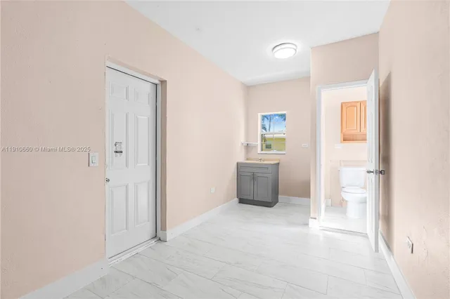 a view of an empty room and window