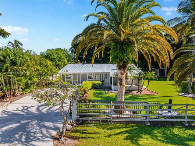 a view of swimming pool with outdoor seating and yard