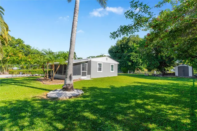 a house view with a sitting space and garden