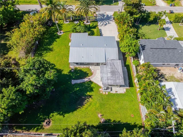 an aerial view of a house with a garden