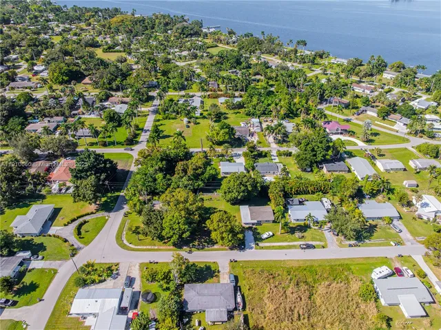 an aerial view of residential house with outdoor space and swimming pool