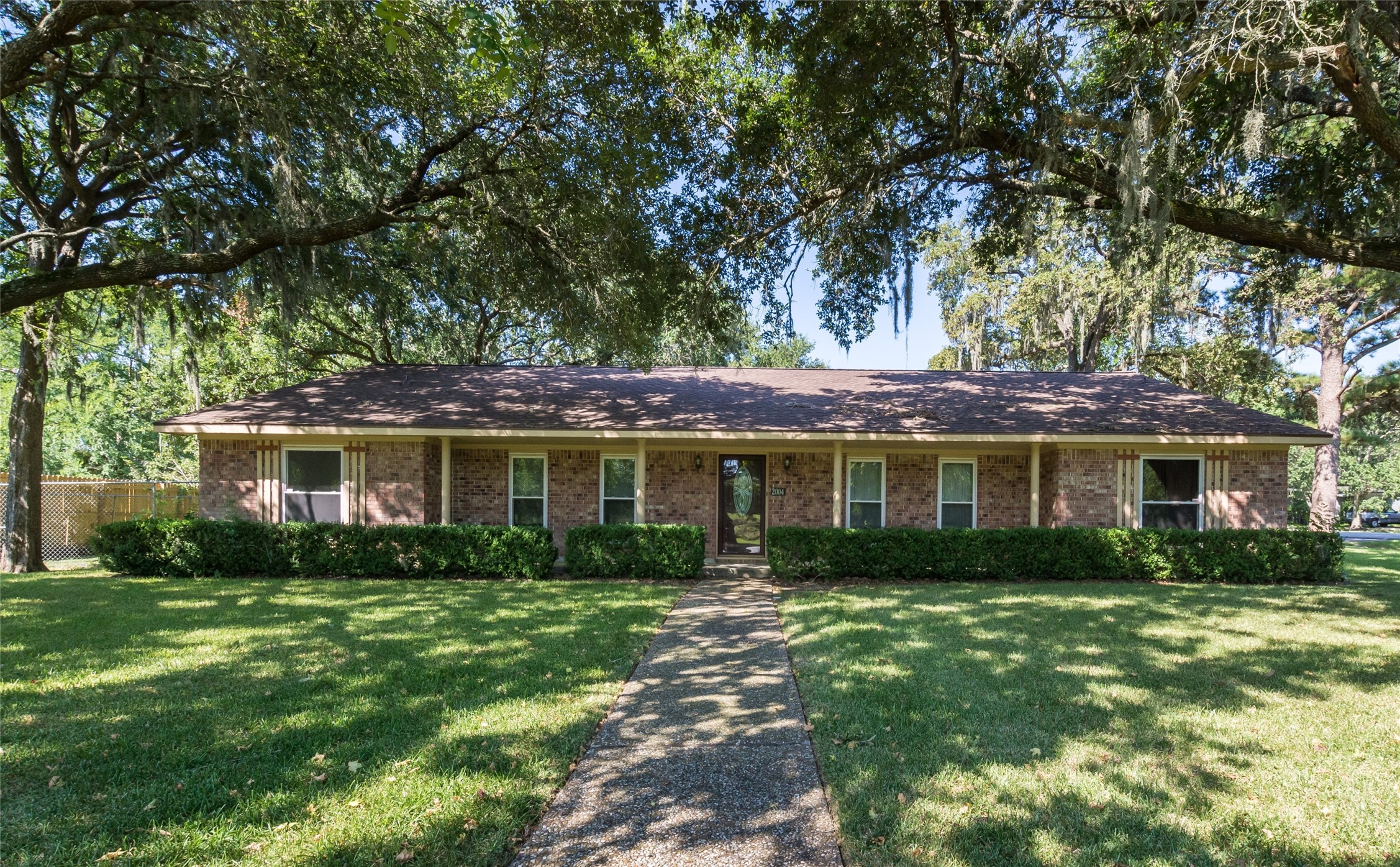 2004 Sleepy Hollow Drive Pearland, TX 77581 - Photo 1 of 13 a front view of house with yard and green space