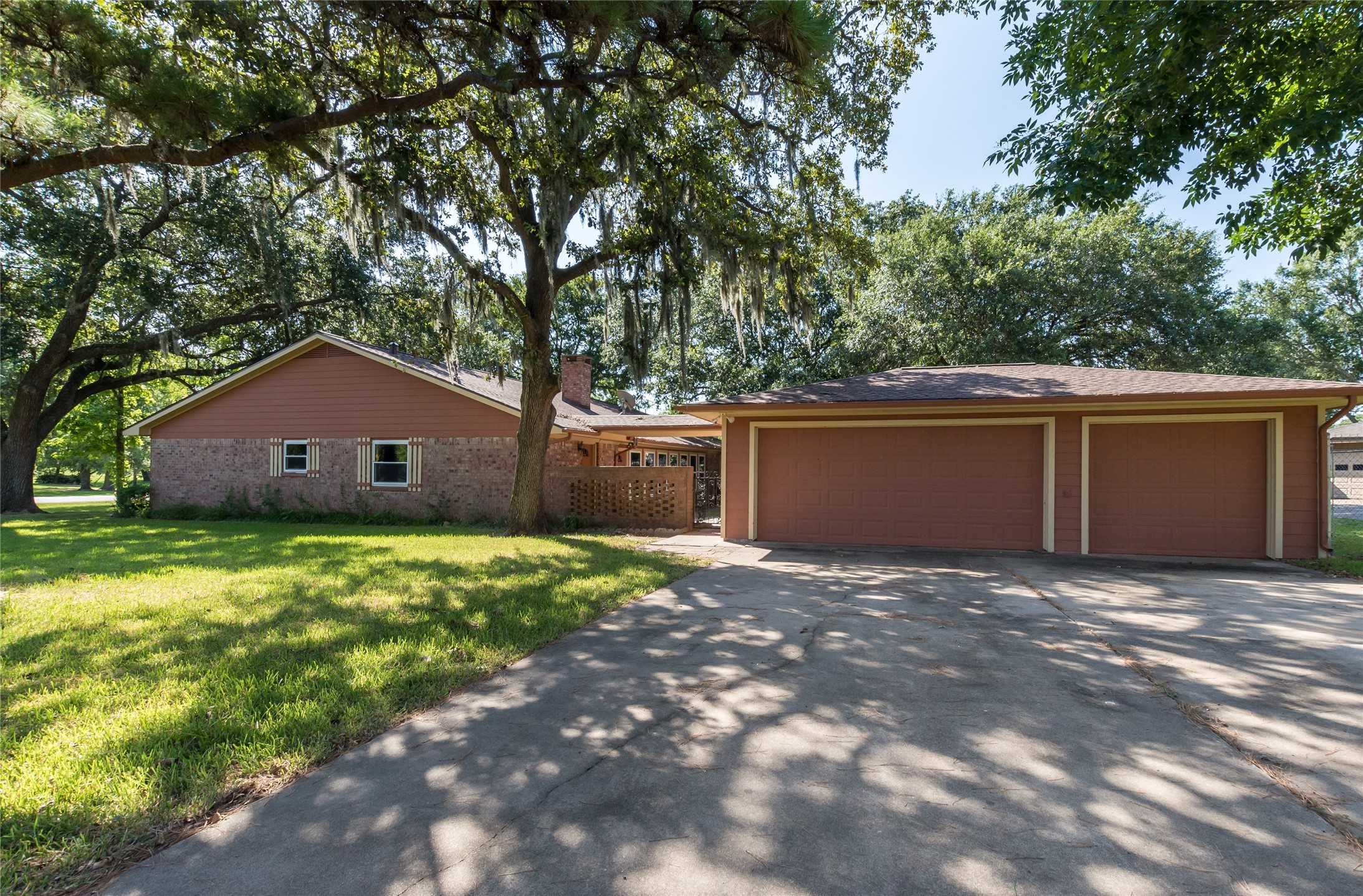 2004 Sleepy Hollow Drive Pearland, TX 77581 - Photo 2 of 13 a view of a house with a yard and a large tree
