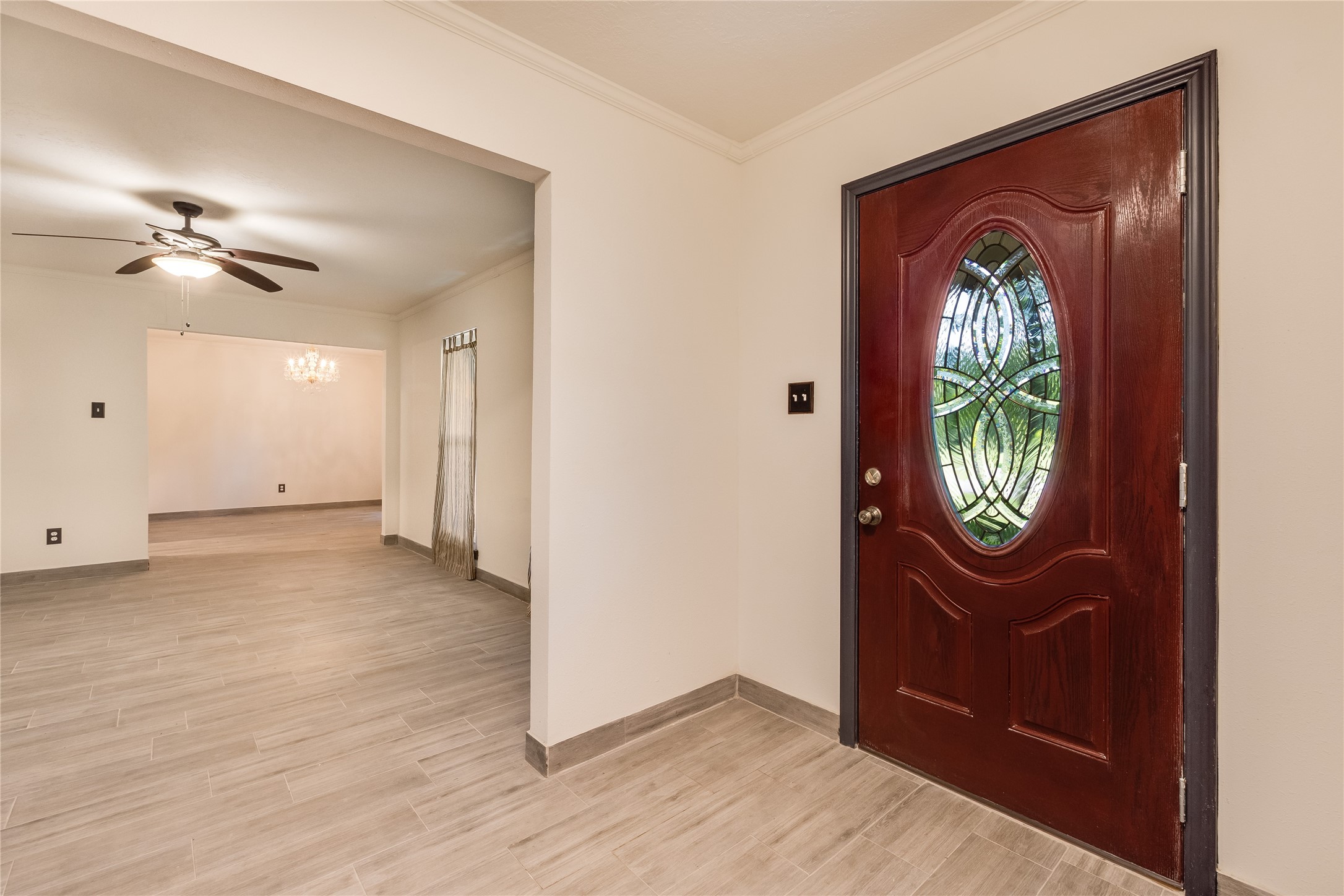 2004 Sleepy Hollow Drive Pearland, TX 77581 - Photo 4 of 13 an empty room with wooden floor a mirror