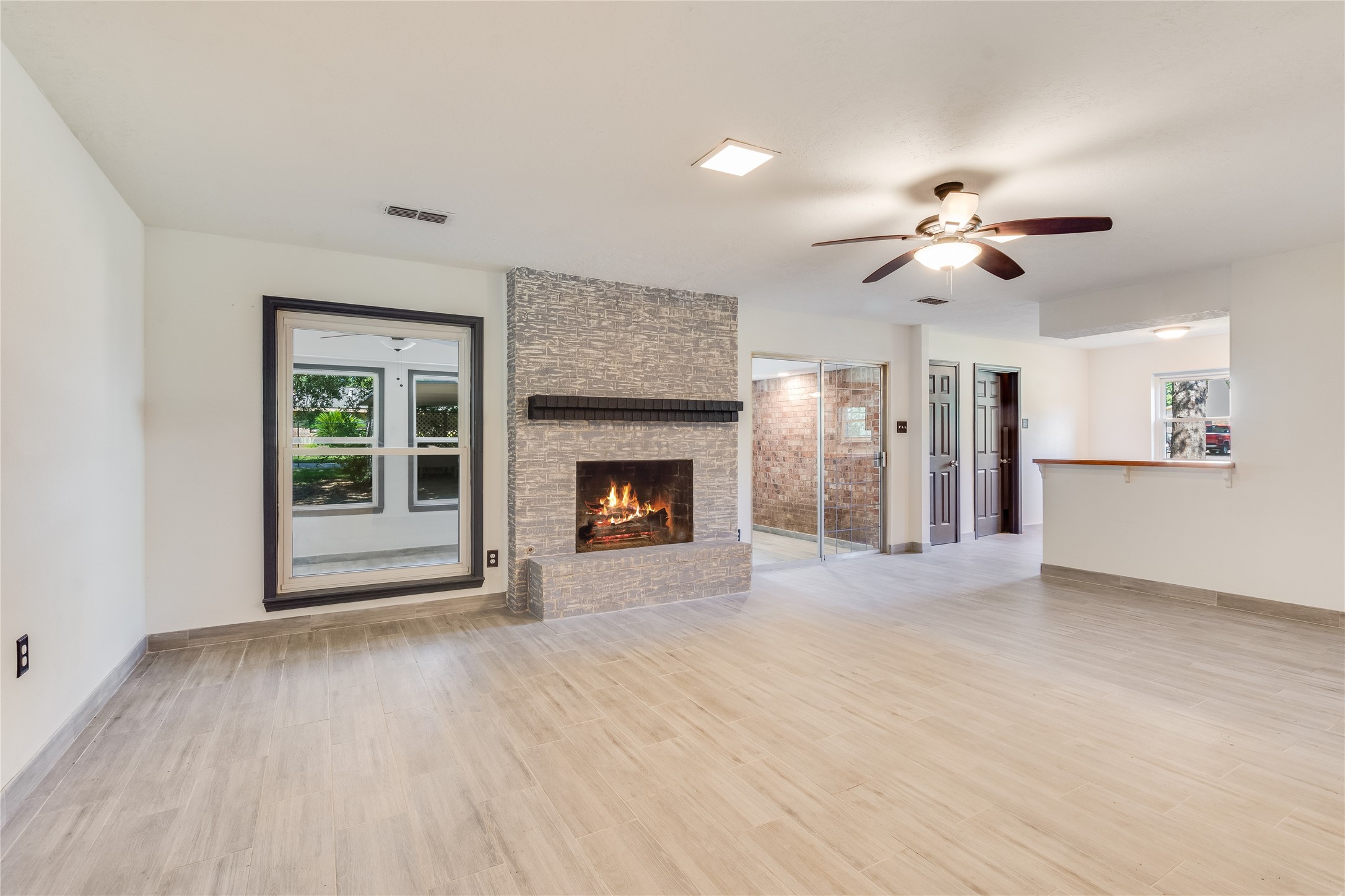 2004 Sleepy Hollow Drive Pearland, TX 77581 - Photo 5 of 13 a view of an empty room with a fireplace and a window