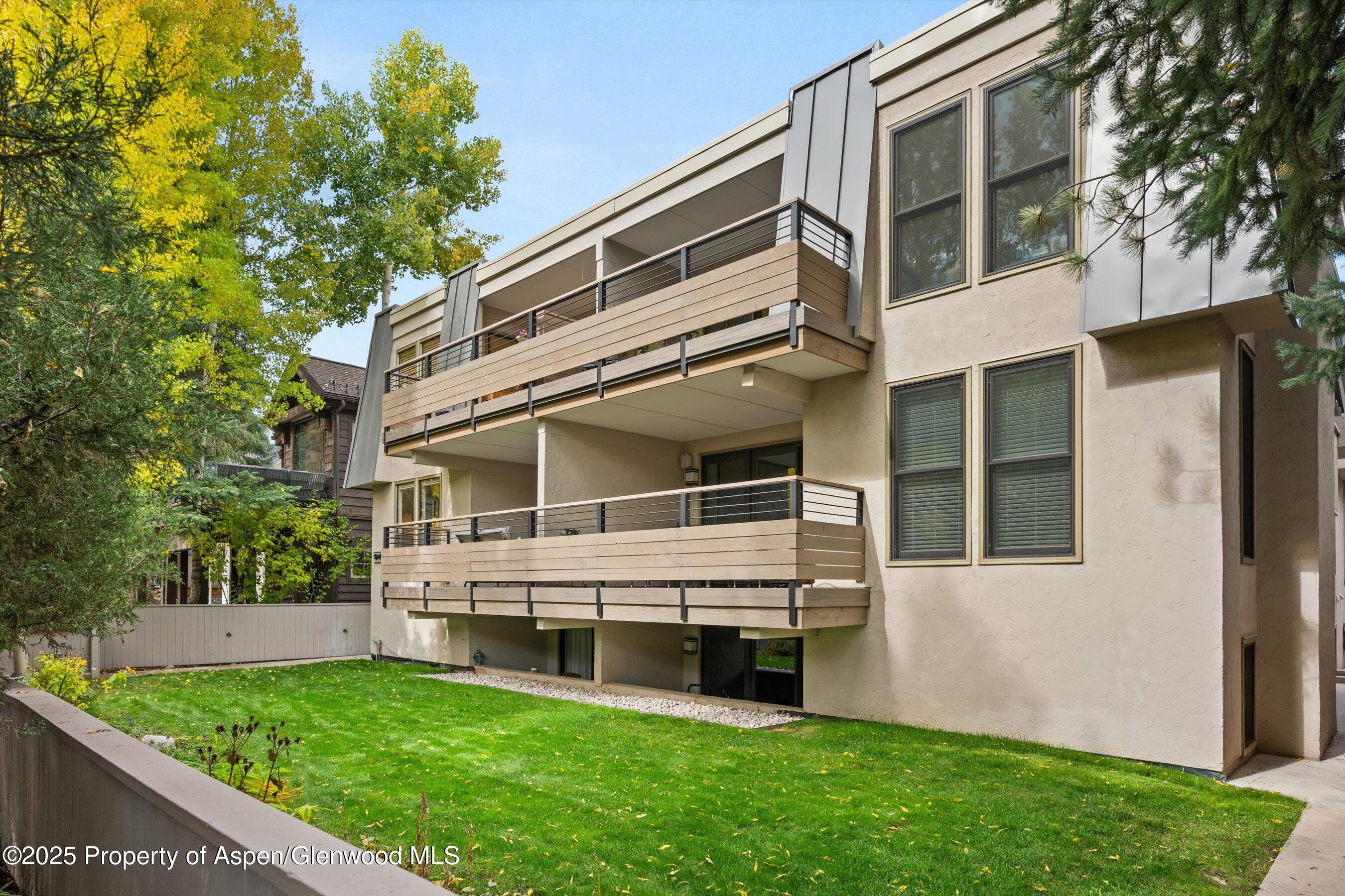980 East Hyman Avenue, Unit 3 Aspen, CO 81611 - Photo 26 of 26 a view of an house with backyard and sitting area