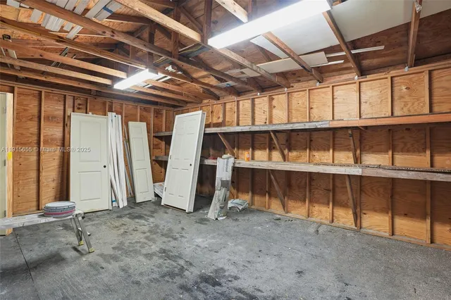 a view of a room with wooden walls
