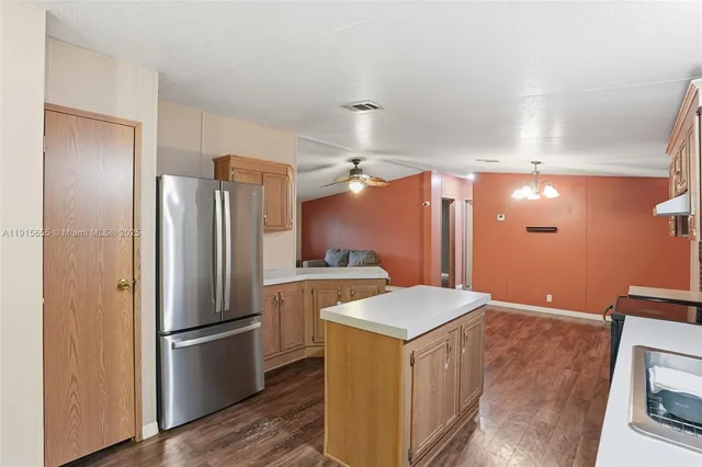 a kitchen with stainless steel appliances a refrigerator and a stove