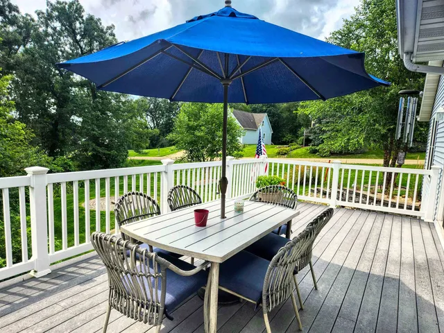 a view of balcony with furniture and wooden deck