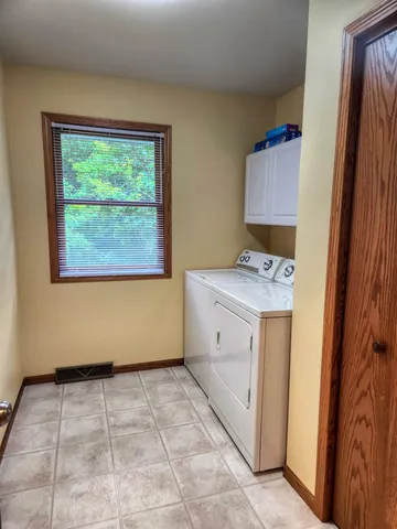 a utility room with a window dryer and washer