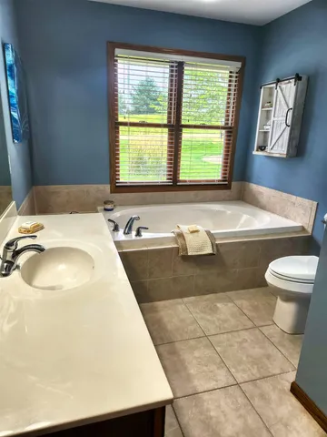 a bathroom with a sink a toilet and a bathtub