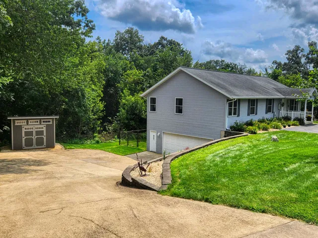 a view of a backyard with a garden