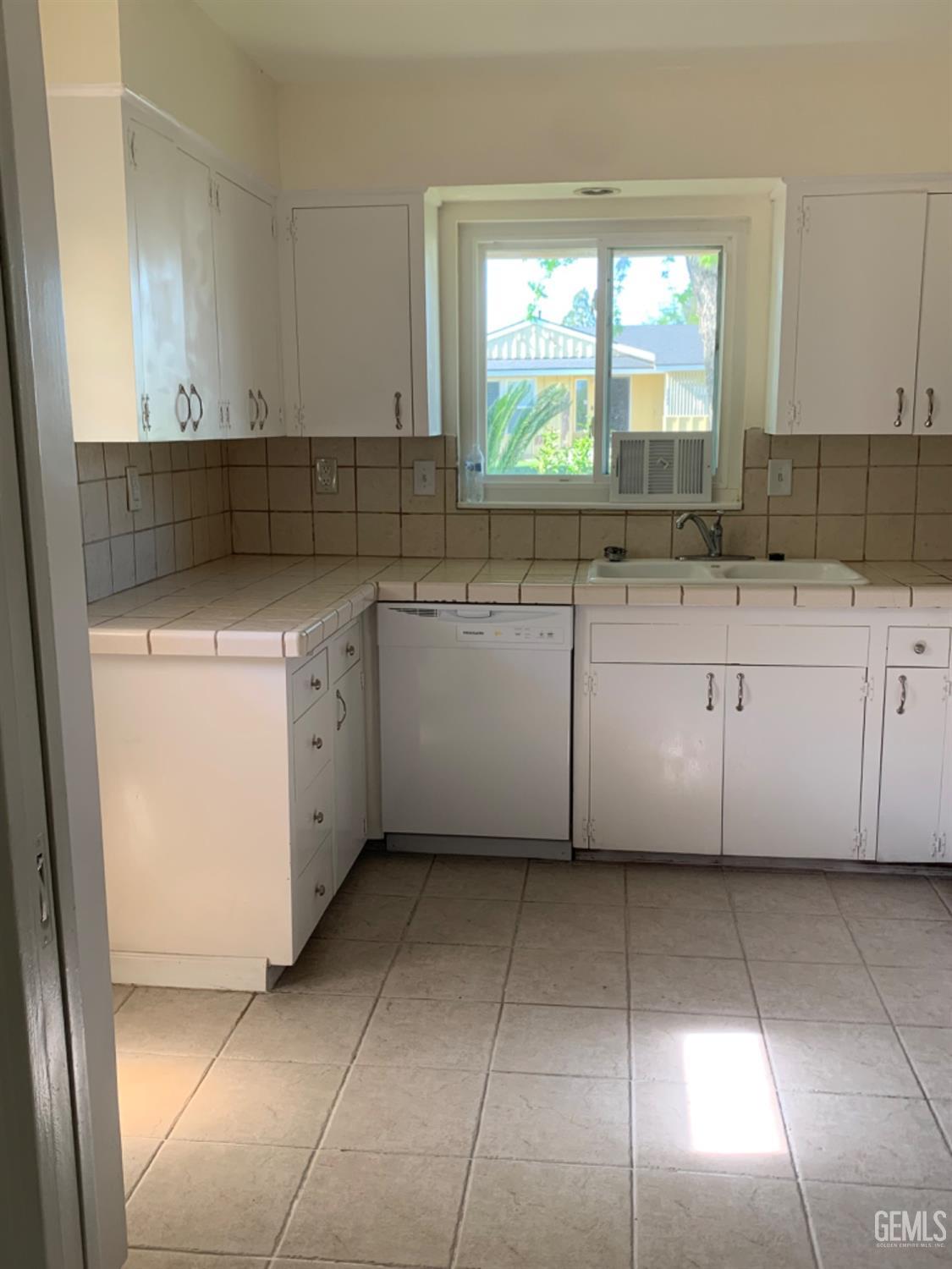 Undisclosed Address Bakersfield, CA 93306 - Photo 12 of 18 a kitchen with cabinets and window