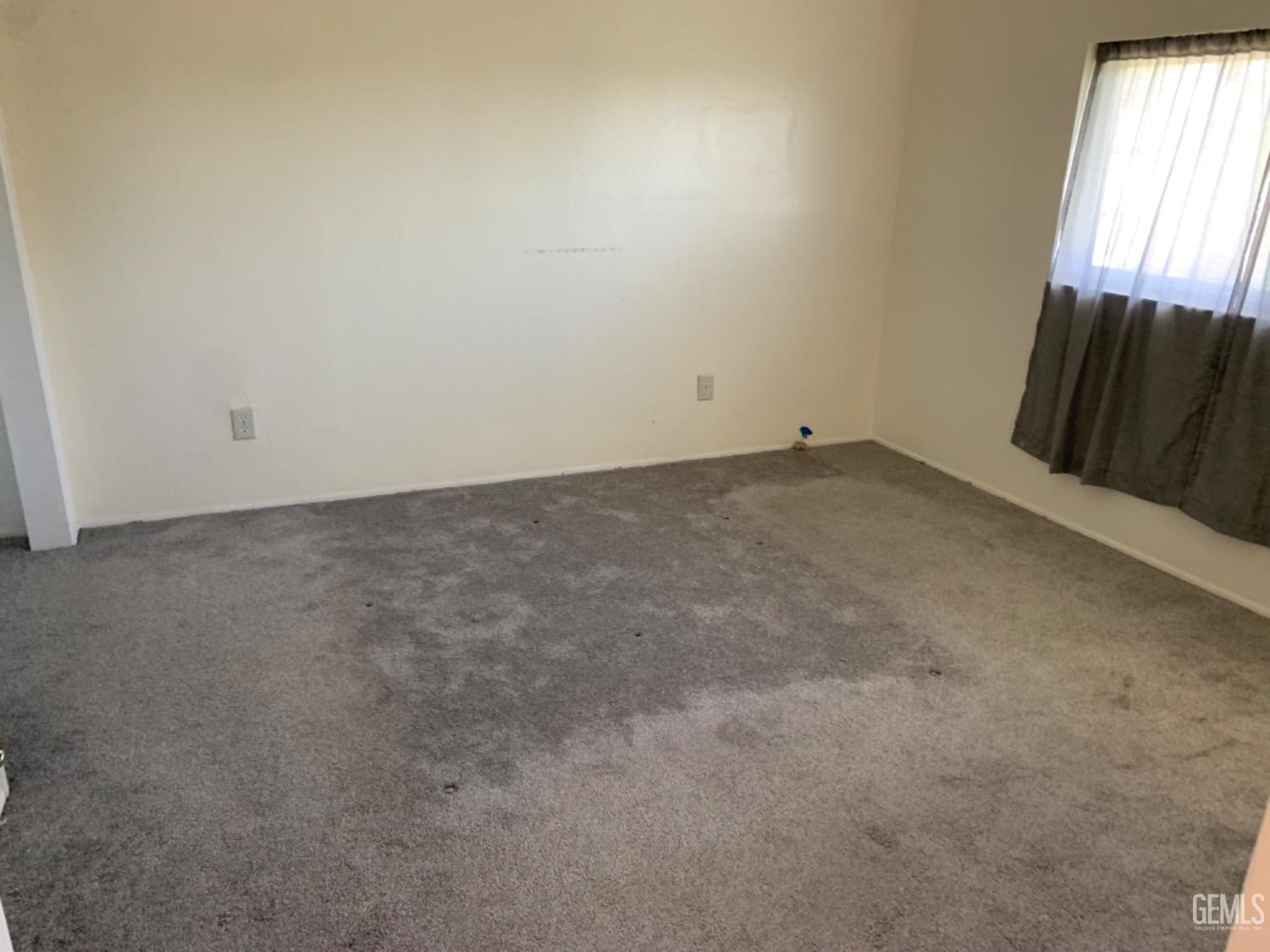 Undisclosed Address Bakersfield, CA 93306 - Photo 14 of 18 a view of an empty room and window