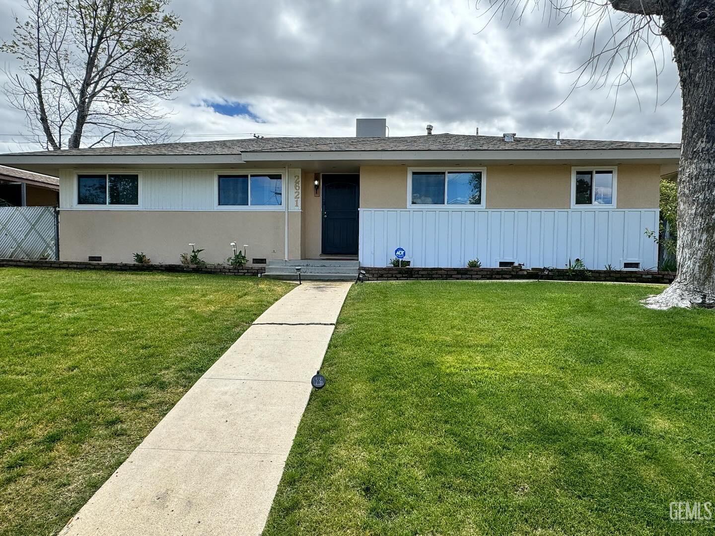 Undisclosed Address Bakersfield, CA 93306 - Photo 2 of 18 a front view of house with yard
