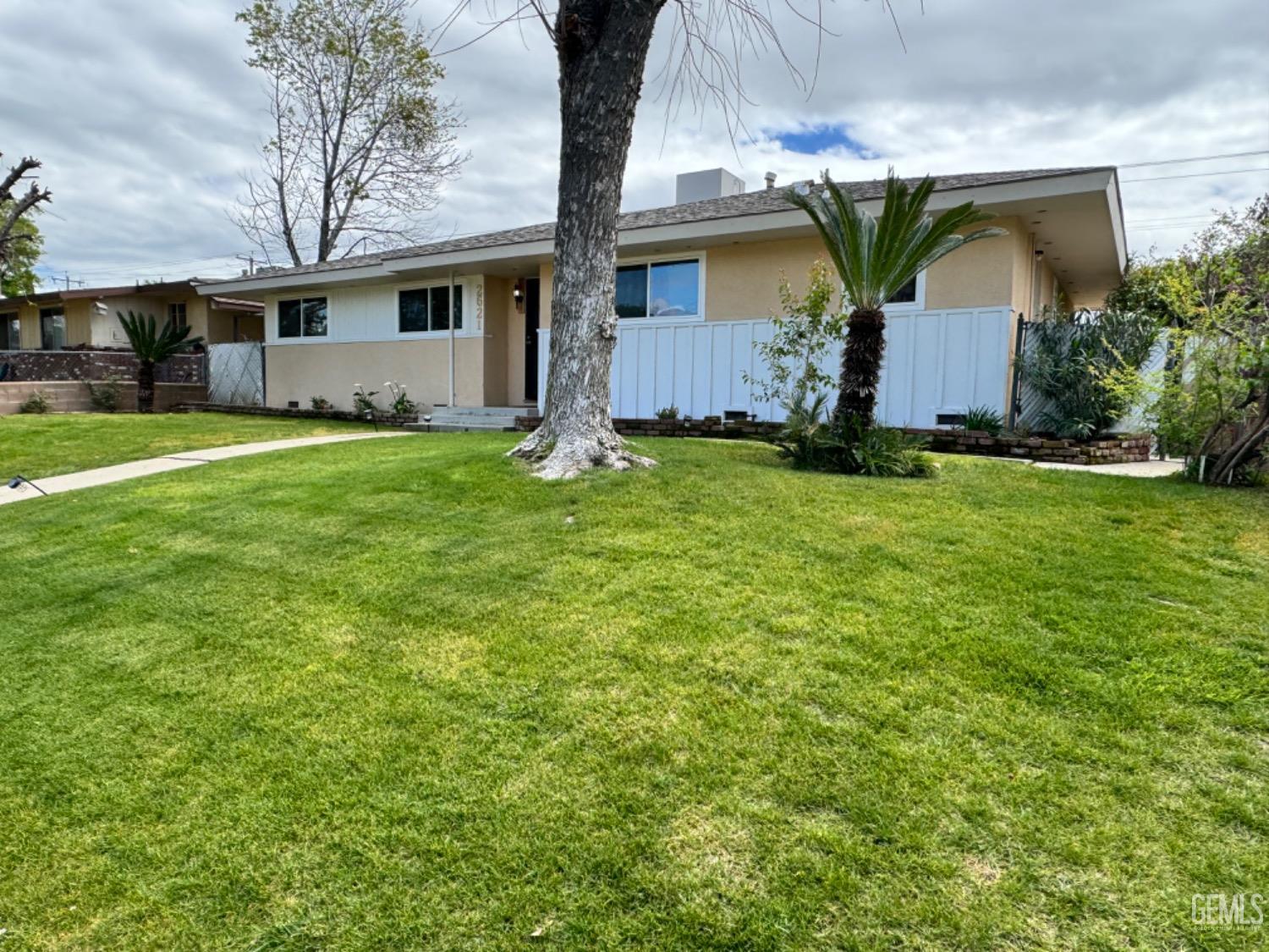Undisclosed Address Bakersfield, CA 93306 - Photo 3 of 18 a view of a house with a backyard