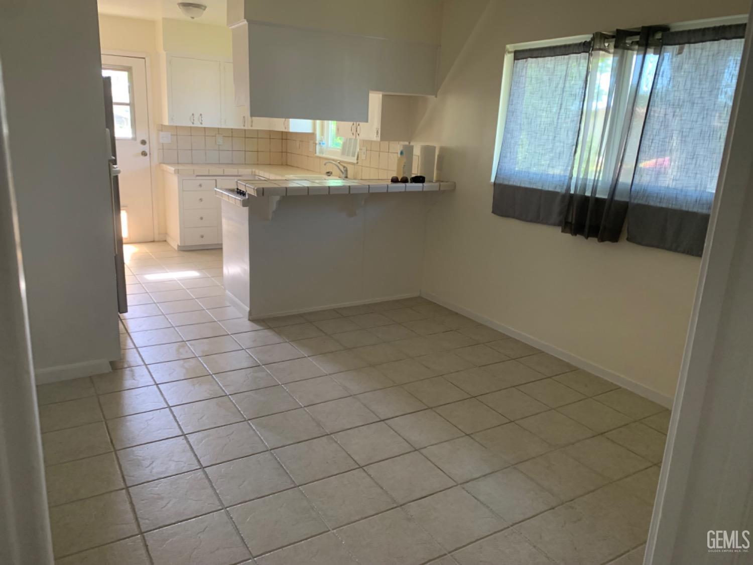Undisclosed Address Bakersfield, CA 93306 - Photo 9 of 18 a kitchen with cabinets and window