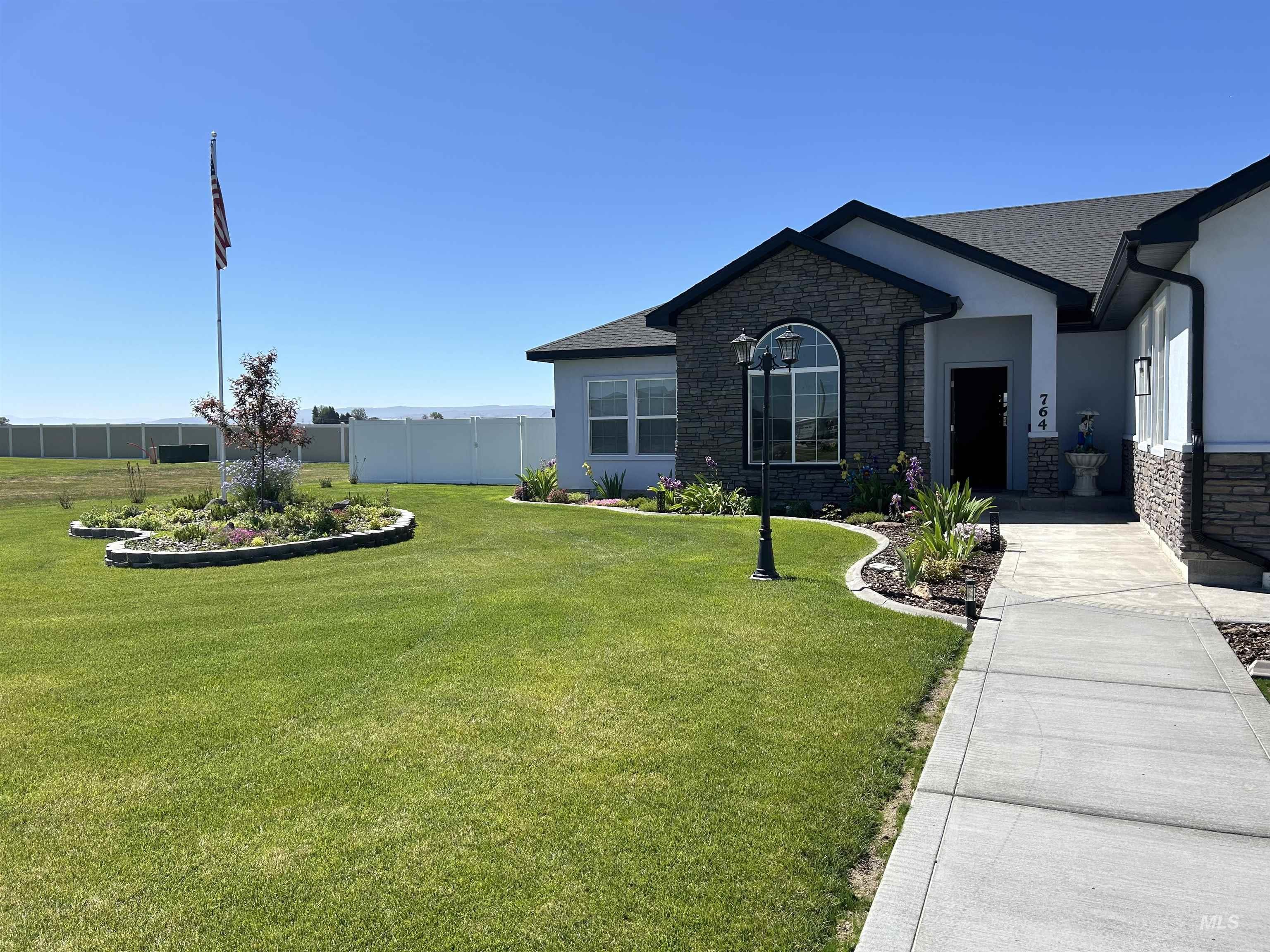 764 Heidi Terrace Kimberly, ID 83341 - Photo 25 of 42 Ranch-style house featuring stone siding, stucco siding, and a shingled roof