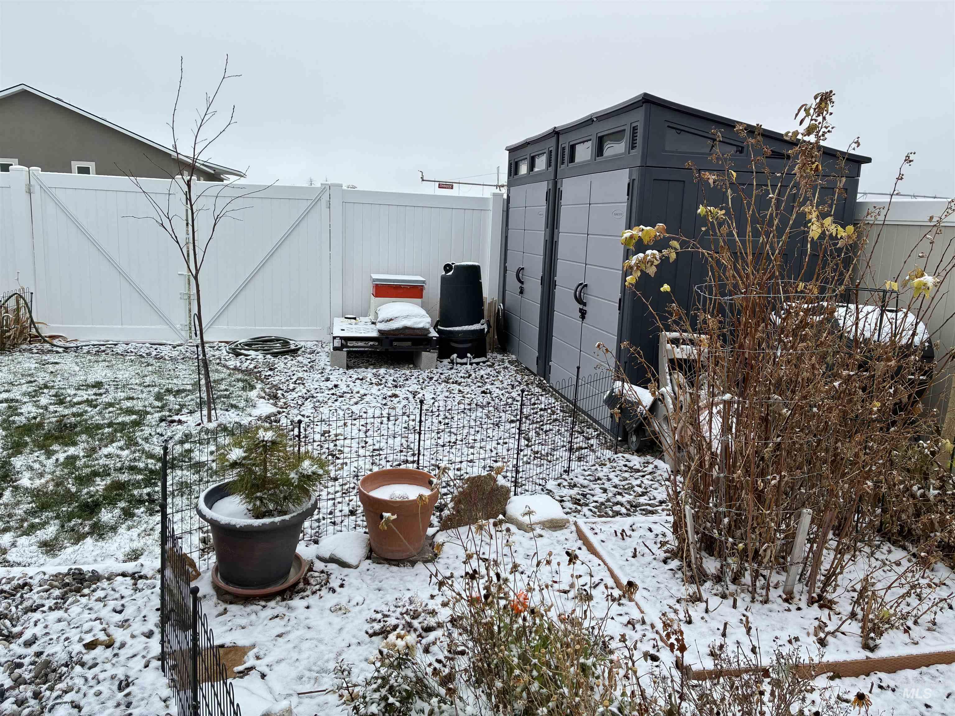 764 Heidi Terrace Kimberly, ID 83341 - Photo 39 of 42 Snow covered patio with a fenced backyard and a shed
