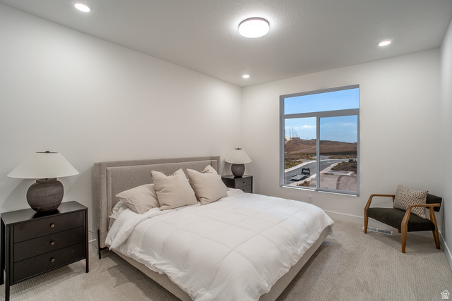 2768 Becco Trail, Unit 63 St. George, UT 84770 - Photo 20 of 27 Bedroom featuring light colored carpet, recessed lighting, and a mountain view