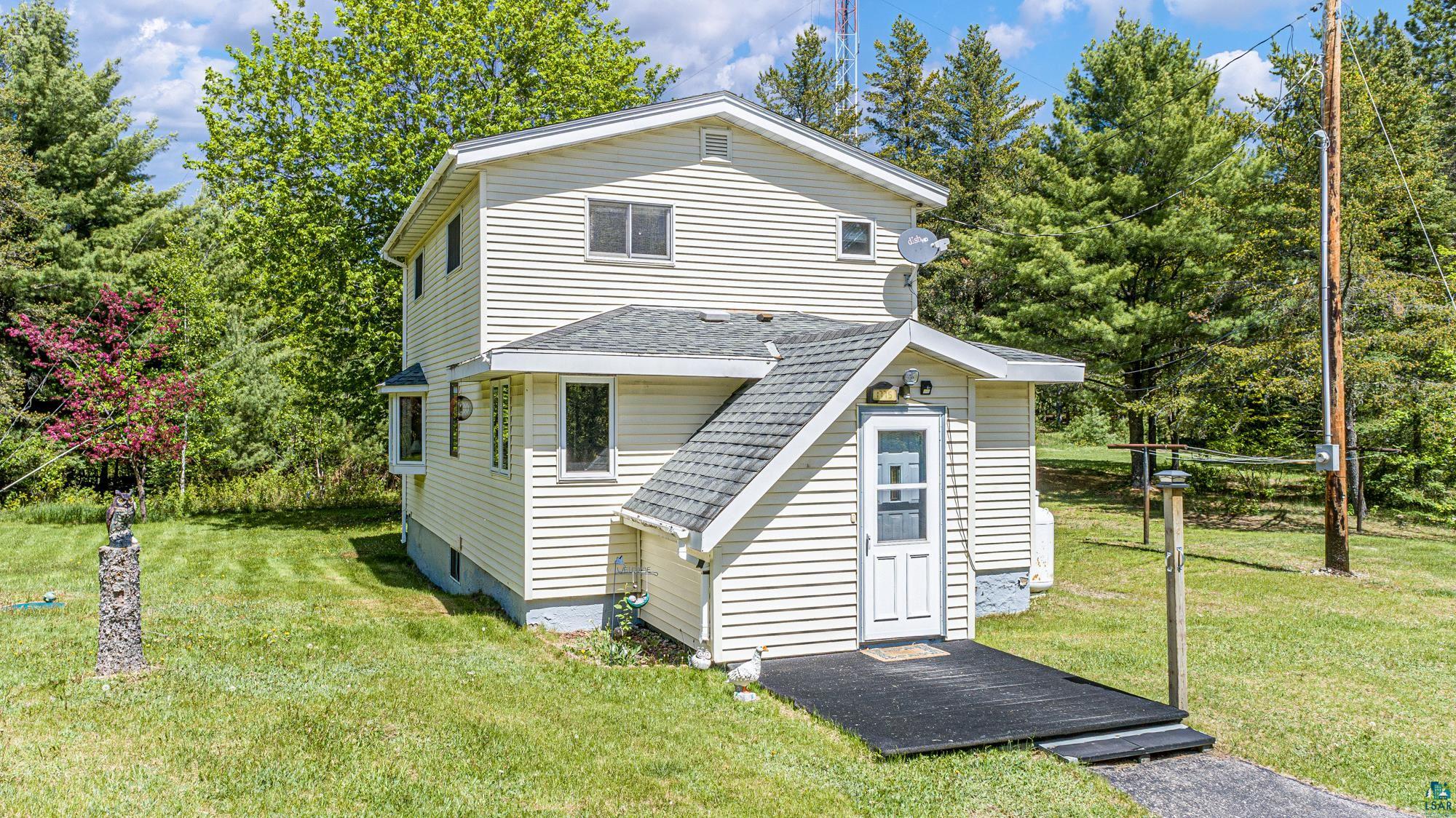 Exterior space with a front lawn