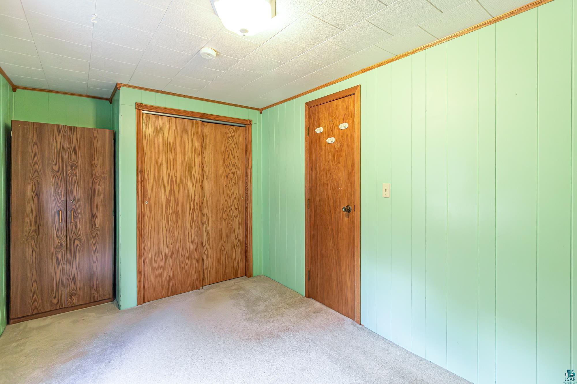 1775 Lookout Road Ely, MN 55731 - Photo 13 of 44 Unfurnished bedroom with a closet and carpet