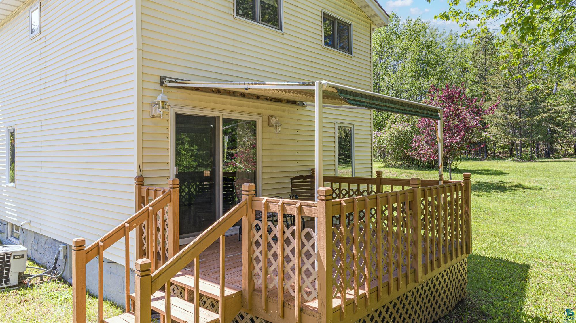 1775 Lookout Road Ely, MN 55731 - Photo 35 of 44 Deck featuring central AC unit and a yard
