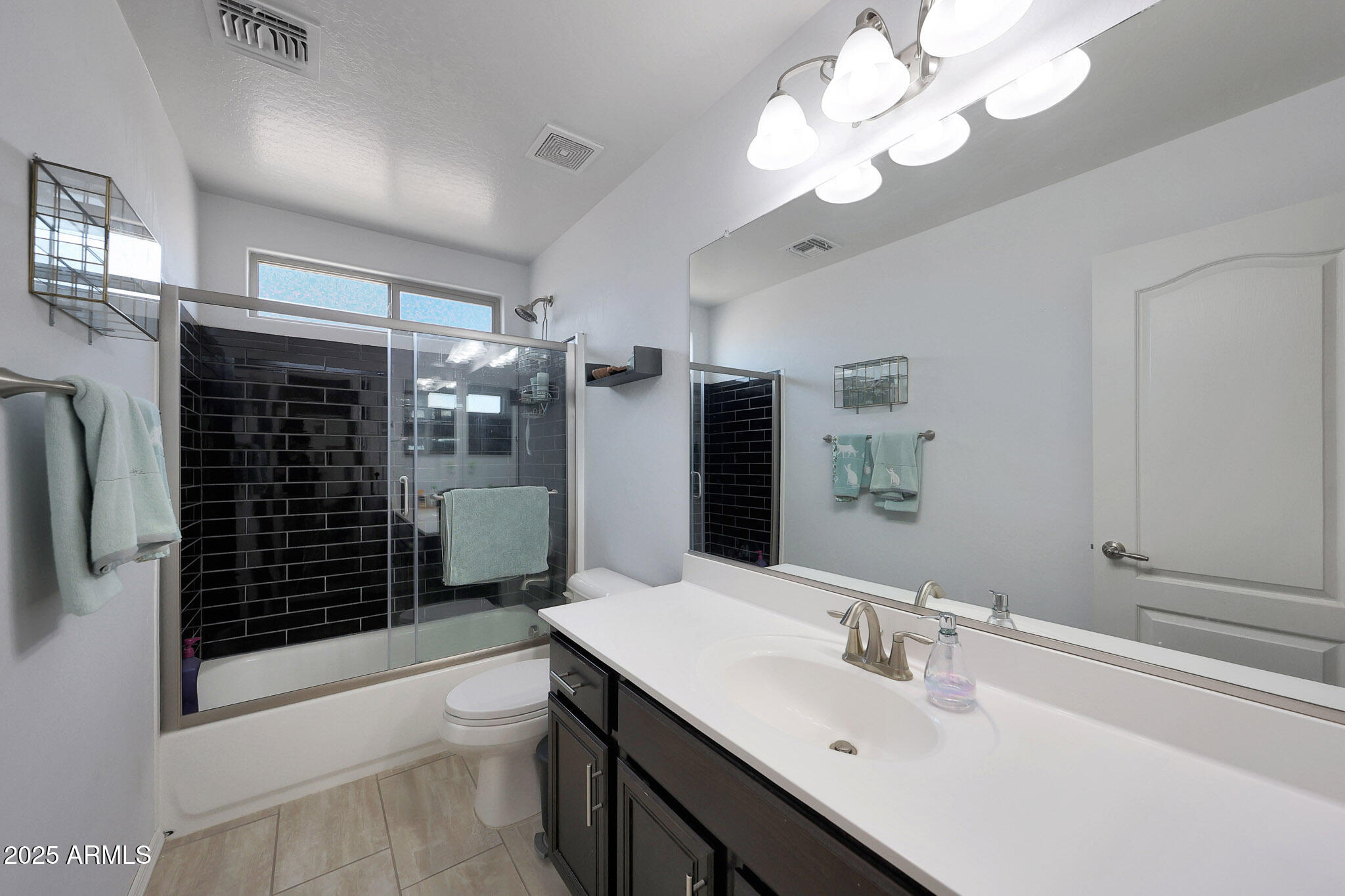 3446 North Mayfair Mesa, AZ 85213 - Photo 19 of 49 a bathroom with a sink a toilet and shower