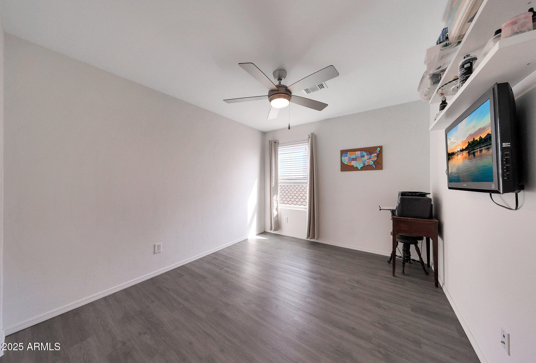 3446 North Mayfair Mesa, AZ 85213 - Photo 20 of 49 a view of a livingroom with furniture wooden floor and a ceiling fan