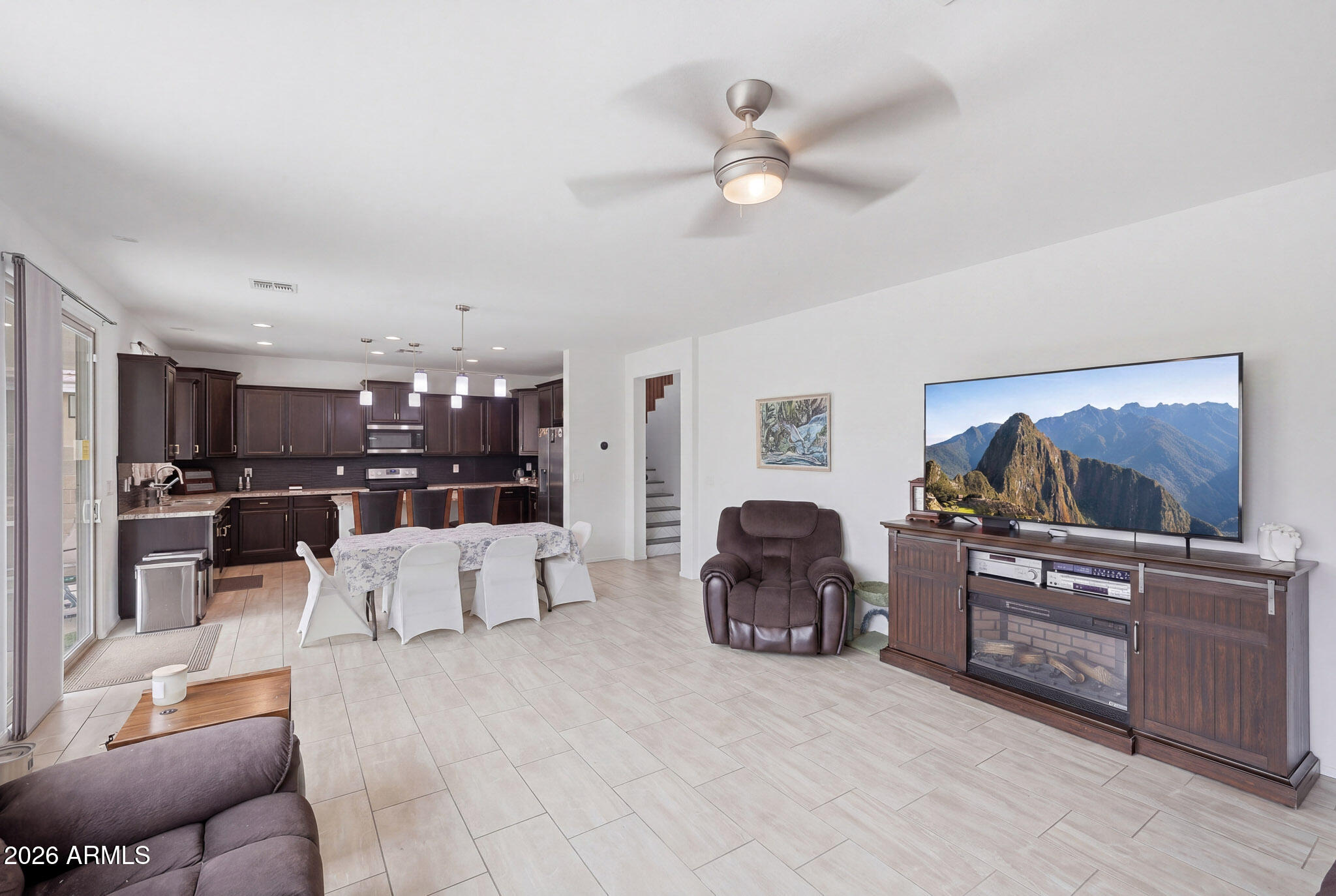 3446 North Mayfair Mesa, AZ 85213 - Photo 2 of 49 a living room with furniture and a flat screen tv