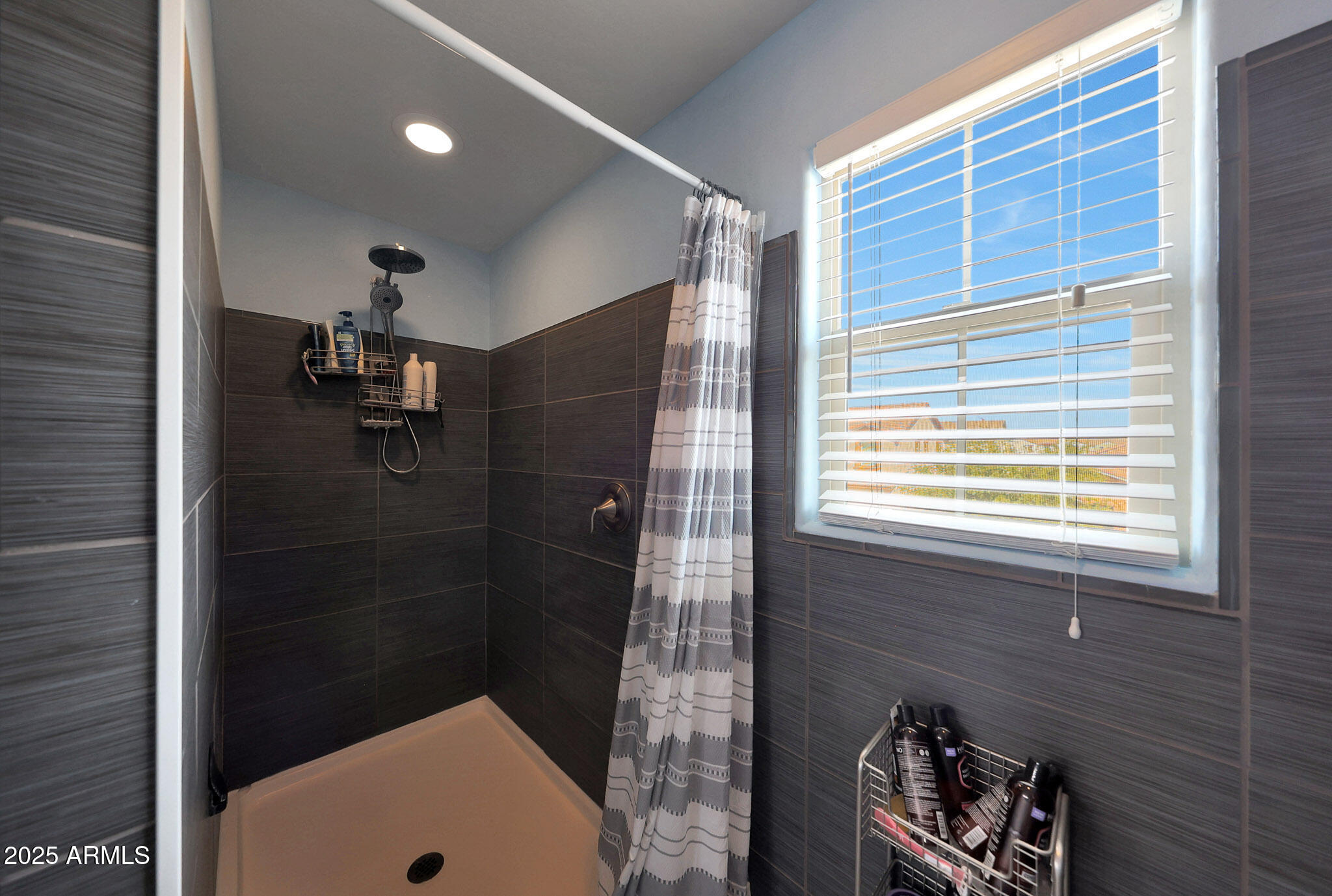 3446 North Mayfair Mesa, AZ 85213 - Photo 28 of 49 a bathroom with a tub and a shower