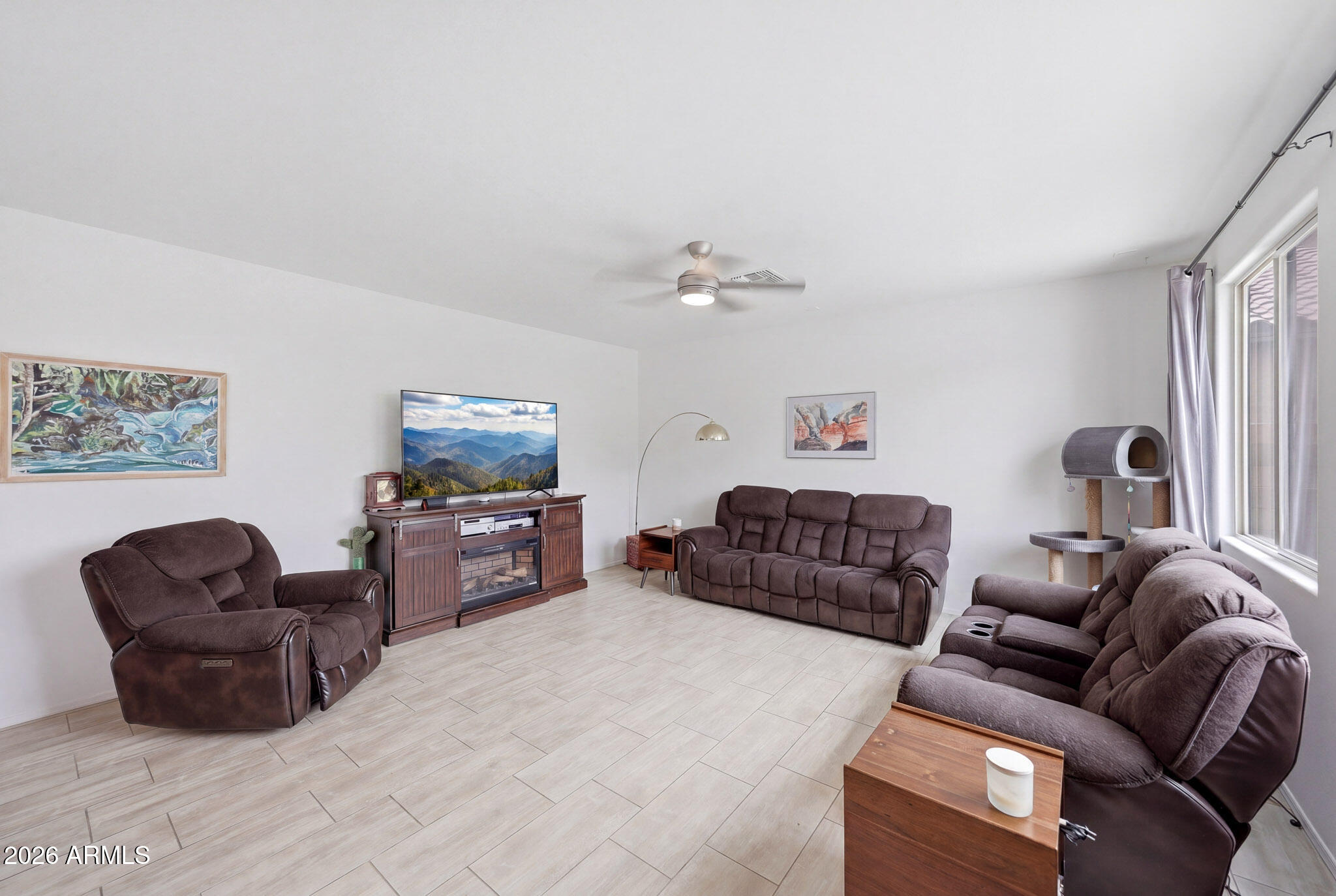 3446 North Mayfair Mesa, AZ 85213 - Photo 3 of 49 a living room with furniture and a flat screen tv