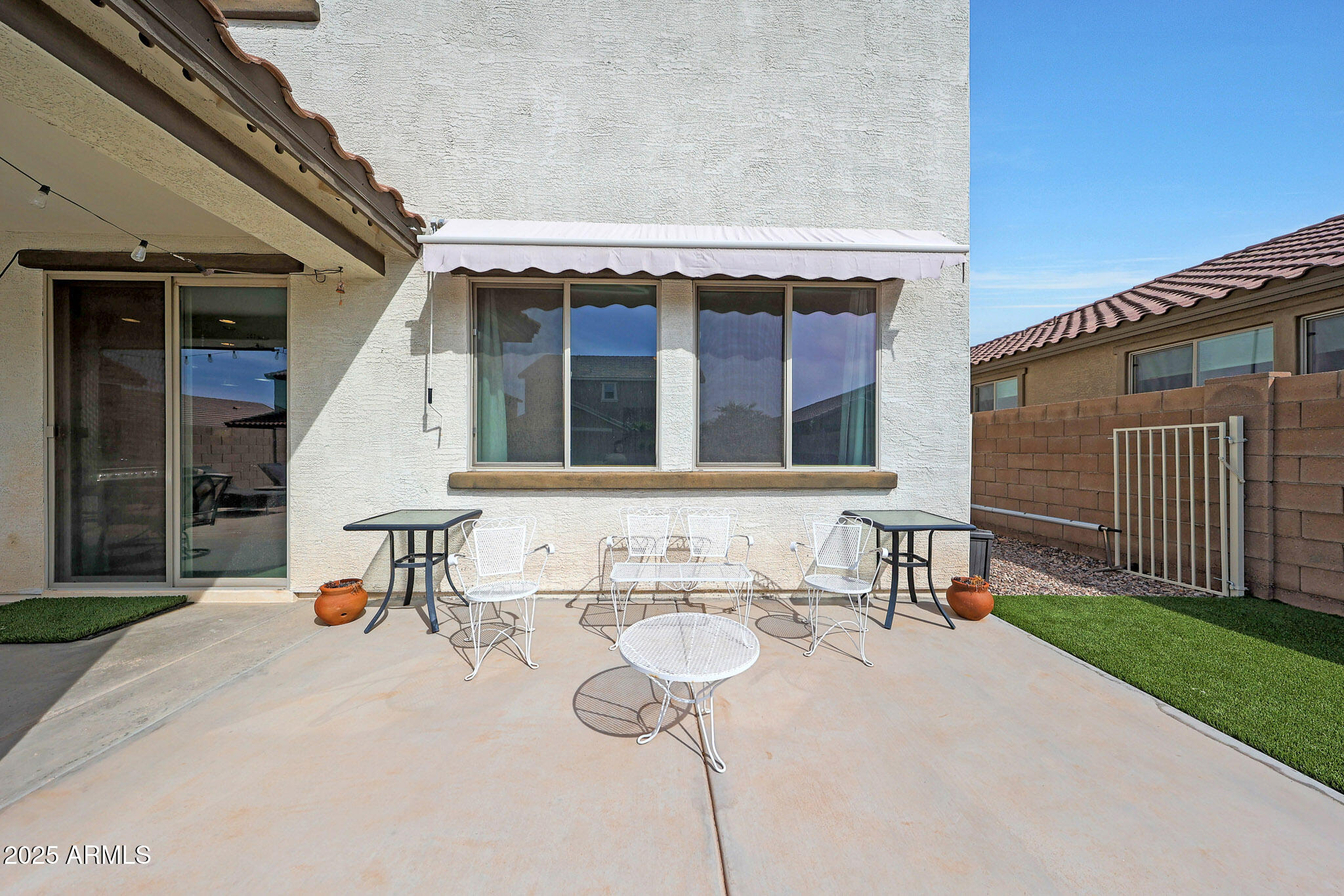 3446 North Mayfair Mesa, AZ 85213 - Photo 45 of 49 a view of a patio with table and chairs with wooden fence