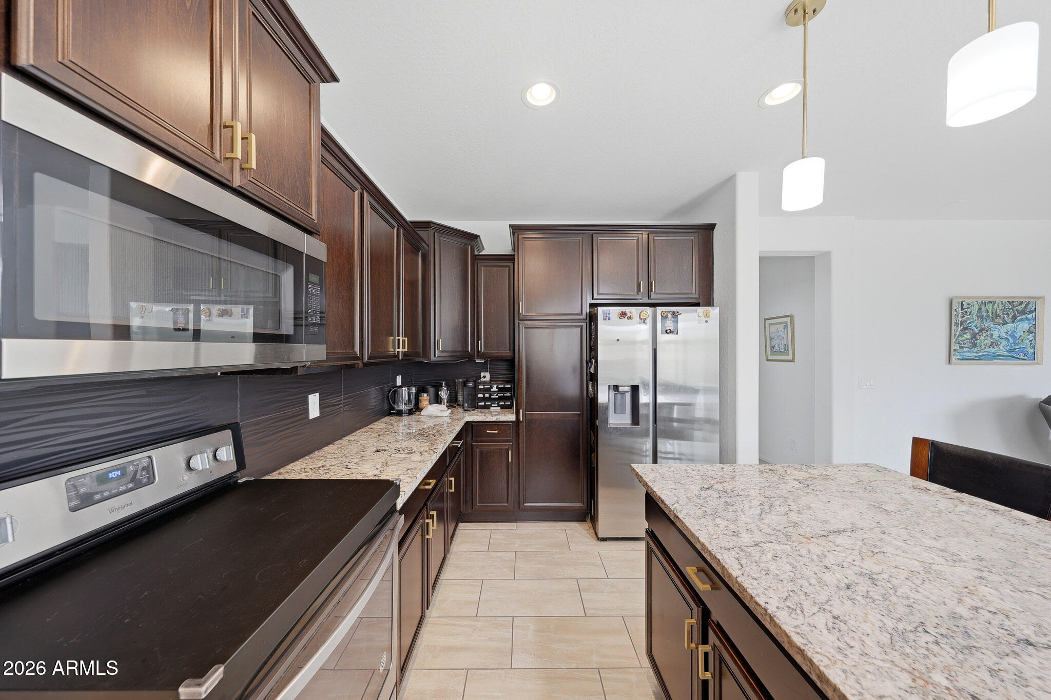 3446 North Mayfair Mesa, AZ 85213 - Photo 6 of 49 a kitchen with stainless steel appliances granite countertop a refrigerator a stove and a sink