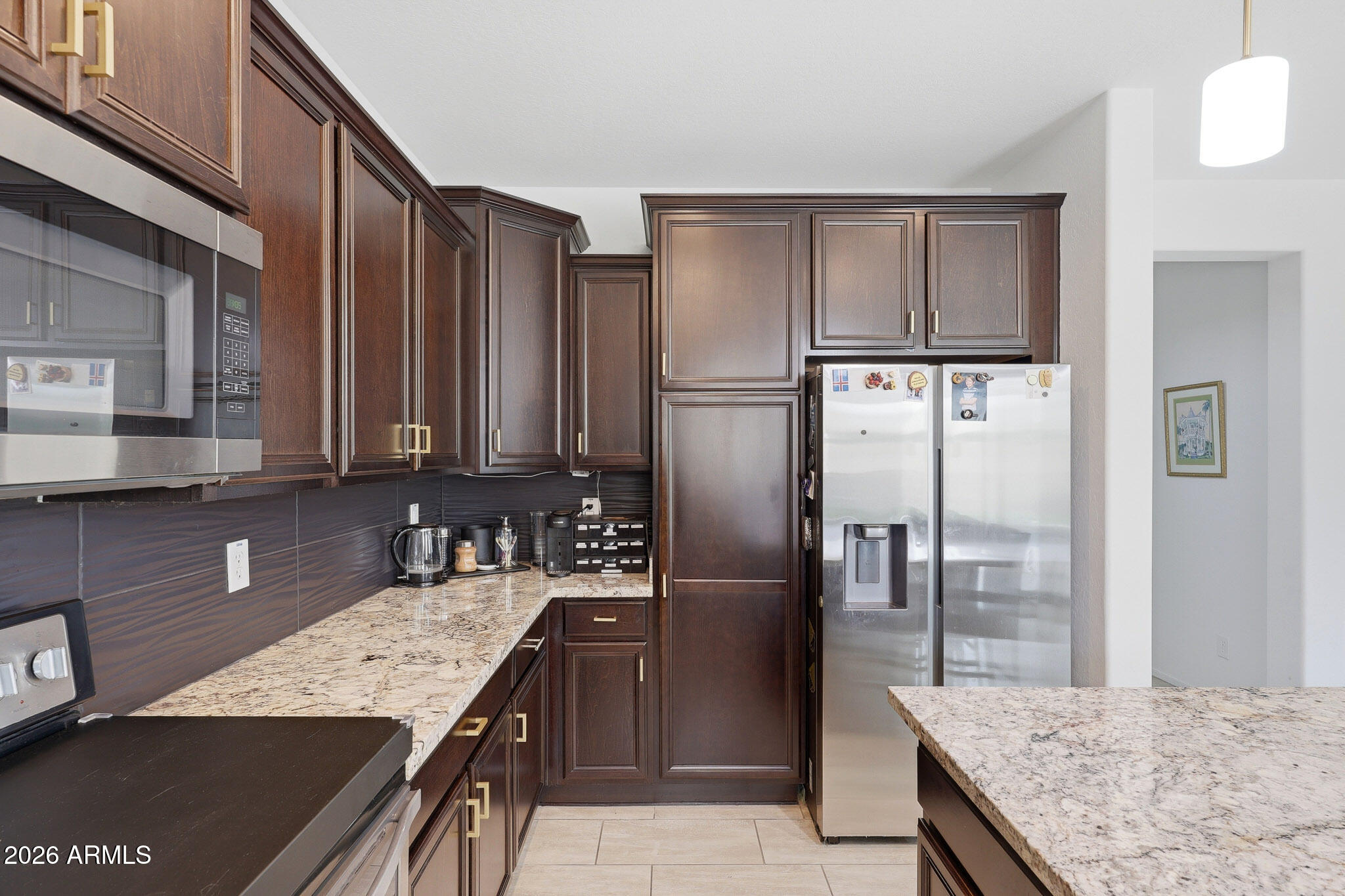 3446 North Mayfair Mesa, AZ 85213 - Photo 7 of 49 a kitchen with granite countertop a refrigerator and a sink