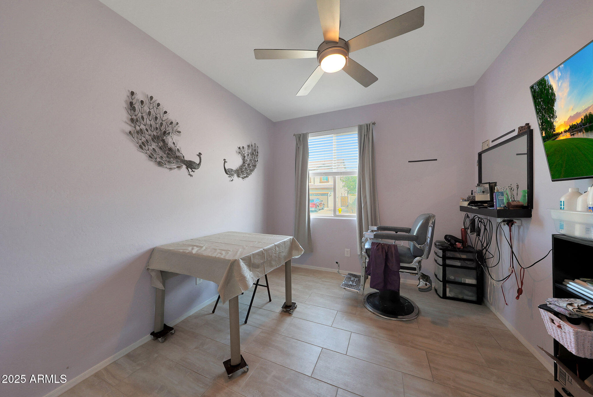 3446 North Mayfair Mesa, AZ 85213 - Photo 9 of 49 a view of a workspace with furniture and a flat screen tv