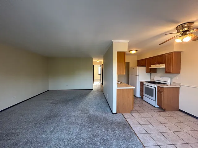 a view of a kitchen with a sink and microwave