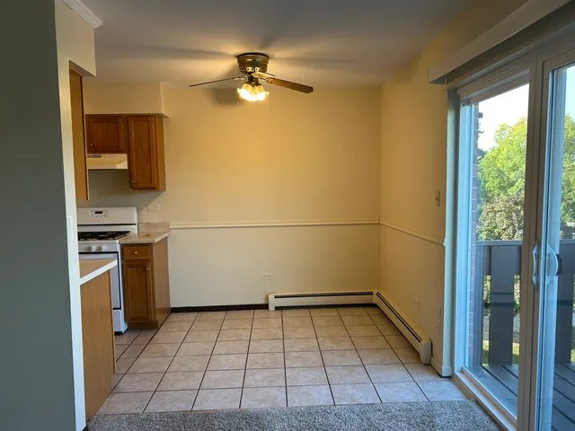 a view of a kitchen with a sink an oven and cabinets