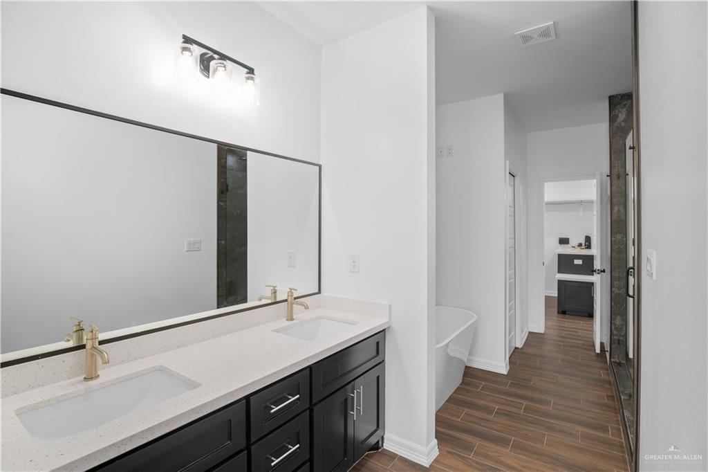 3701 South Solstice Road Edinburg, TX 78542 - Photo 10 of 17 a bathroom with a sink and a mirror