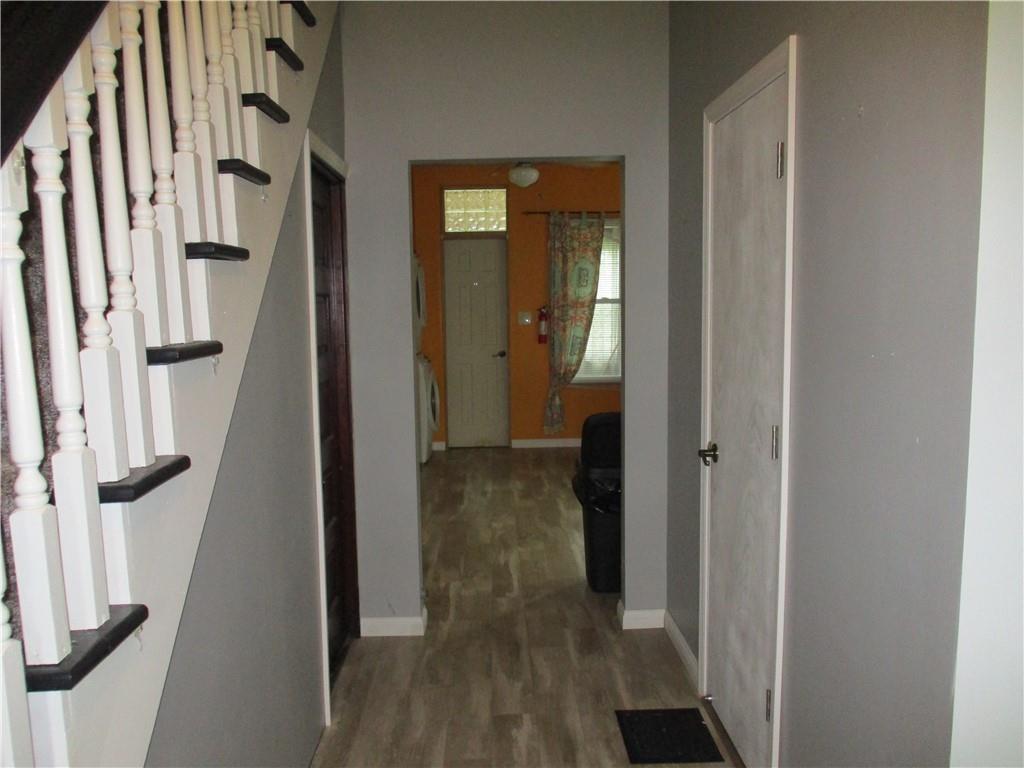 320 Main Street Lyndora, PA 16045 - Photo 5 of 11 a view of a hallway with wooden floor and entryway