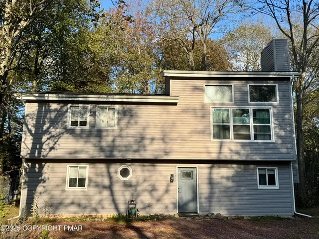a view of house with outdoor space