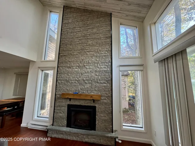 a view of an entryway with fireplace