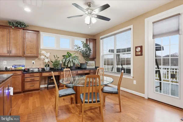 a living room with furniture a fireplace and a potted plant
