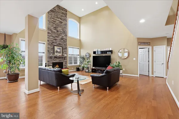 a living room with furniture windows and a fireplace