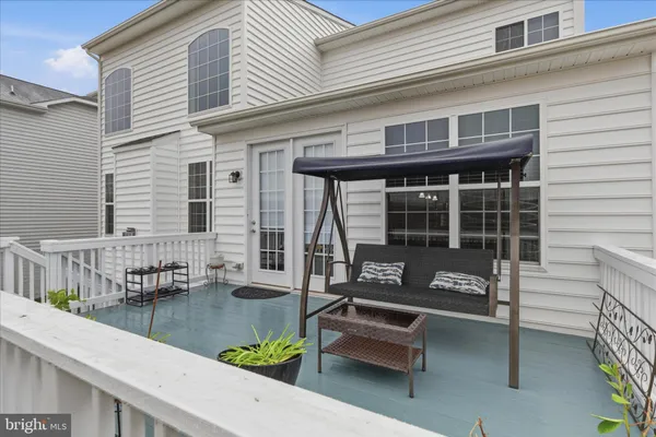 a spacious bedroom with a bed and a chandelier